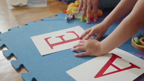 Through creative play and personalized instruction, a child receives support Stock Footage 264086581