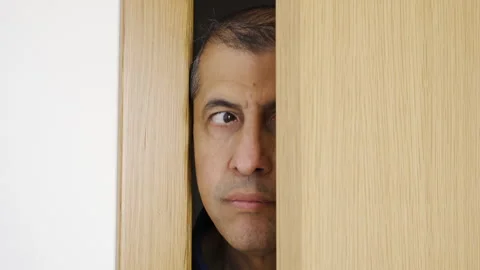 Through the door as concept of nosy man Stock-Footage 273586655