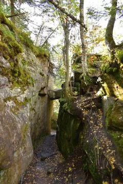 A through narrow gap is an arch between quartz sandstone megaliths in the Kam Stock Photos