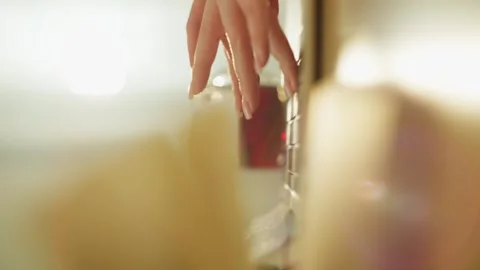 Through the pages of the book, you can see how women's hands work on a laptop. Stock Footage 274065849