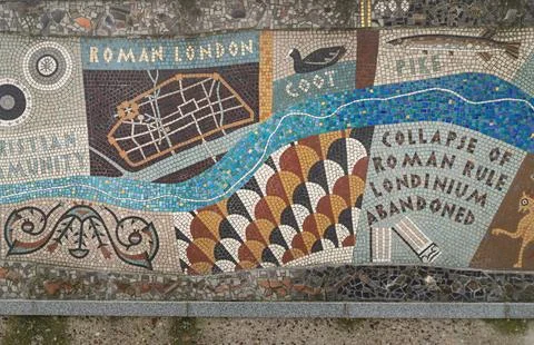 Through a patchwork of architectural precision, a mosaic river flows past t.. Stock Photos