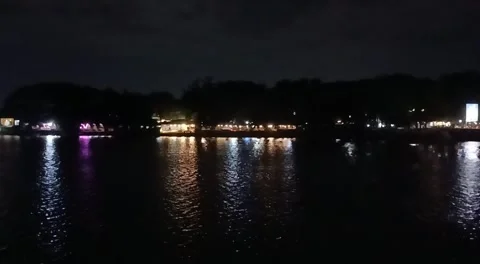 Through the River's Flow, a Café Shines Bright 動画素材 288065304