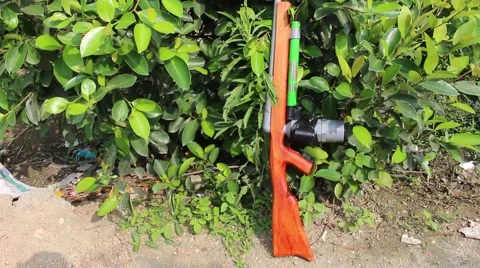 Through shoulder view of a man shooting a gun, sporting gun Stock Footage 49699784