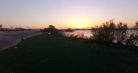 Through the weeds onto the river 動画素材 97076923