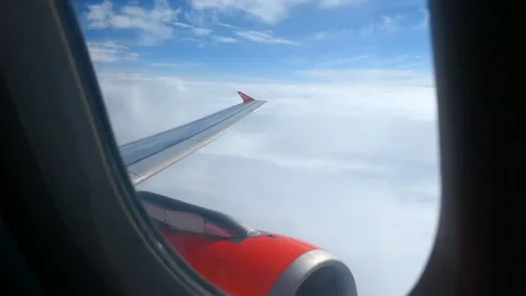 Through the window of an easyJet plane flying Stock Footage 244741057