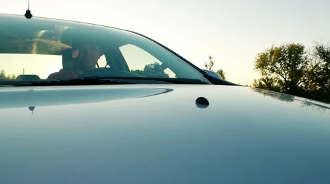 Through the windshield. Driver rides in the car, Start driving on the road Stock Footage 56172557