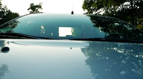 Through the windshield. Driver rides in the car, Start driving on the road Stock Footage 56172571