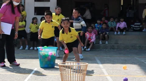 Throw the ball, kindergarten Students are studying Physical Education in School Stock Footage 59788335