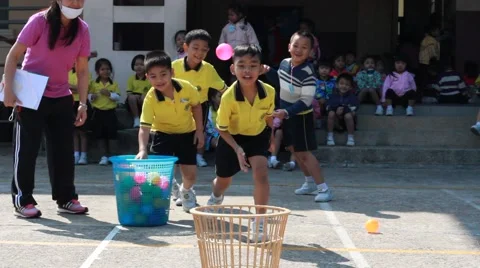Throw the ball, kindergarten Students are studying Physical Education in School Stock Footage 59788583