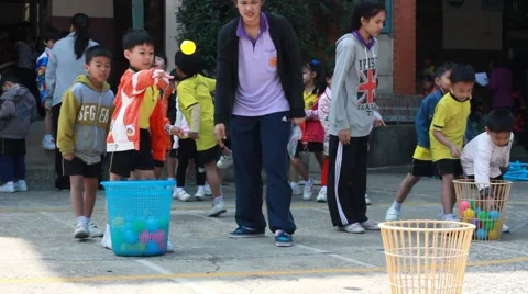 Throw the ball, kindergarten Students are studying Physical Education in School Stock Footage 59788763