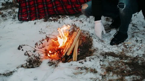  To throw chips in a small bonfire in winter to make it red Stock Footage 121158285