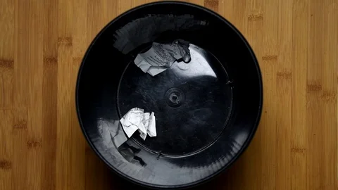 Throw crumpled into the trash, top view Stock-Footage 98298141