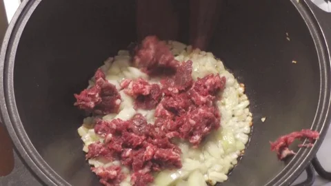 Throw in Fried Onion Raw Ground Beef Stock Footage 73504675