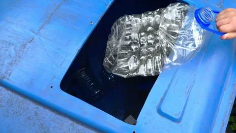 Throw garbage into a trash container. Stock Footage 270936985