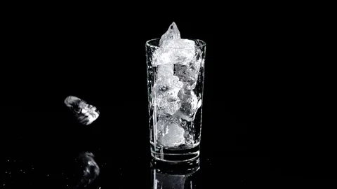 Throw ice into glass Stock Footage