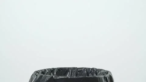 Throw many crumpled paper into the trash. Overflowing waste paper in garbage bin Stock Footage 144661112