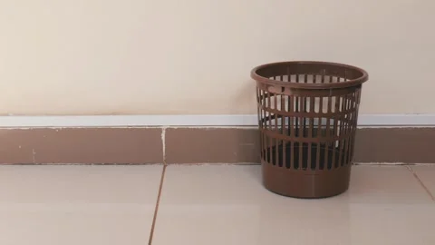 Throw papers into plastic trash Stock Footage 105795882