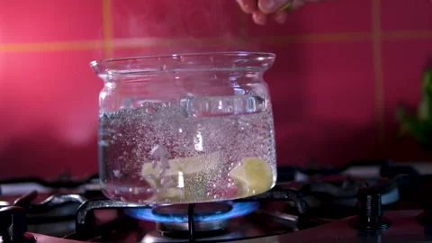Throw potatoes into boiling water Potatoes are boiling in a saucepan on a Stock Footage 302844364