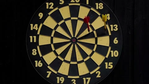Throw three red and one yellow darts at the dart board Stock Footage 159584926