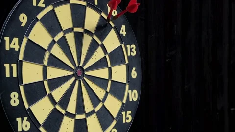 Throw three red and one yellow darts at the dart board Stock-Footage 159584964