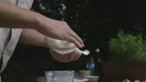 Throwing and shaping the dough for flatbread and the pizza Stock Footage 146386662