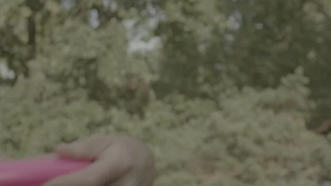 Throwing away a frisbee 스톡 동영상 121661159