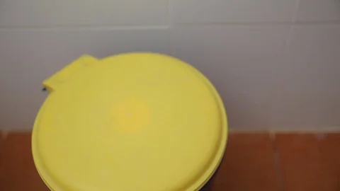 Throwing away garbage in trash can Stock Footage 78496656