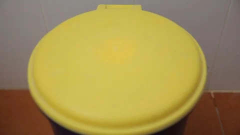 Throwing away garbage in trash can Stock Footage 78496808