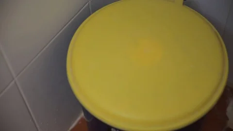 Throwing away garbage in trash can Stock Footage 78500417