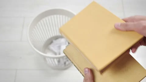 Throwing away multiple books into trash bin. Outdated literature. Stock Footage 130848225