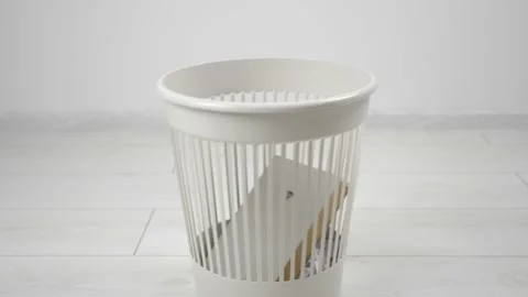 Throwing away multiple books into trash bin. Outdated literature. 库存影片 130979383
