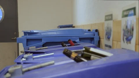 Throwing away plastic in a big waste container Stock Footage 98937049