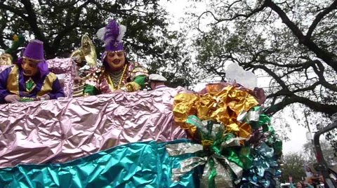 Throwing beads from float during Mardi Gras Day Parade Stock Footage 52373205