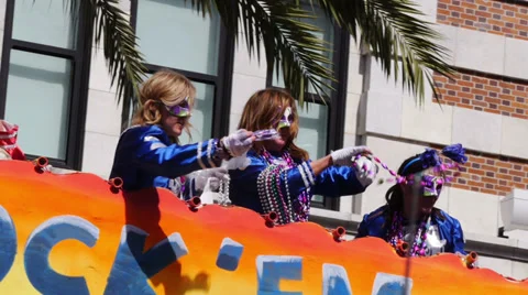 Throwing Beads from a Float in a Mardi Gras Parade 4100 Stock Footage 35796541