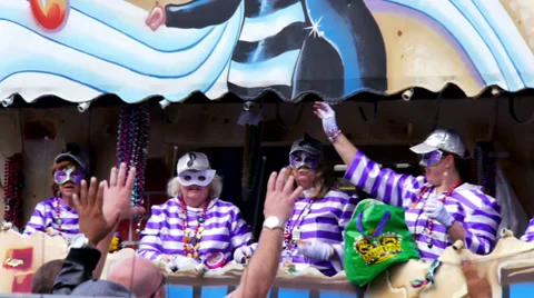 Throwing Beads from a Mardi Gras Parade Float 4106 Stock Footage 35796456