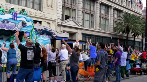 Throwing Beads from a Mardi Gras Parade Float 4101 Stock Footage 35796564