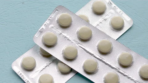 Throwing blister plastic packs with pills tablets one over another Stock Footage 208855532
