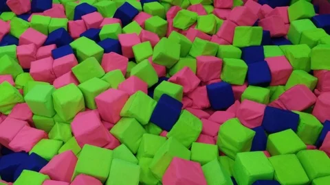Throwing blue cube into pit in amusement center Stock Footage 105716734