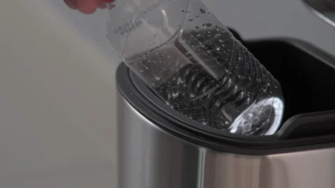 Throwing bottle into the trash Video stock 103153504