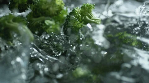 Throwing broccoli into boiling water. Slow Motion. Stock Footage 94083808