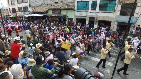 Throwing Candy into the Stands at the Mama Negra Celebration in Ecuador Stock Footage 100601537