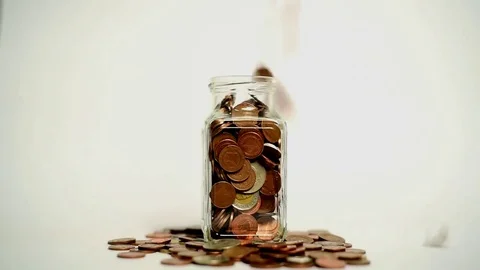Throwing coins into a jar 库存影片 81636236