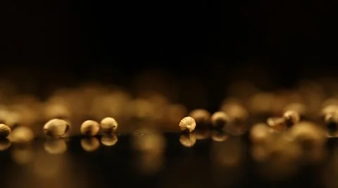 Throwing Coriander Seeds on a black surface Stock Footage 49500963