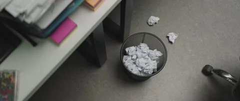 Throwing crumpled papers in to the recycle bin. Trash bin full of paper Stock Footage 199037960