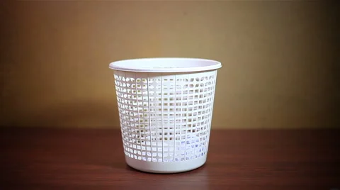 Throwing crushed paper into empty garbage can Video stock 58027977