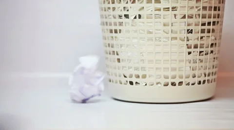 Throwing crushed paper into overfull garbage Stock Footage 58309561