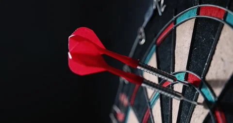 Throwing dart arrows in the dartboard. target marketing concept Stock Footage 203826336