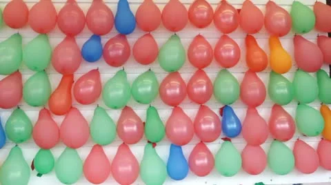 Throwing dart at balloon in carnival game Video stock 11145698