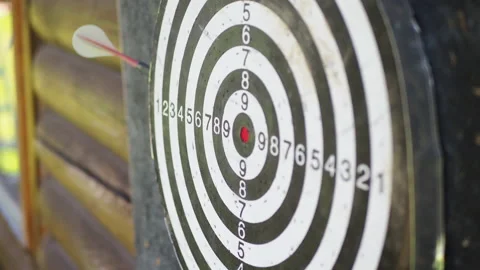 Throwing darts arrows and missing to hit the target. Video stock 137914063