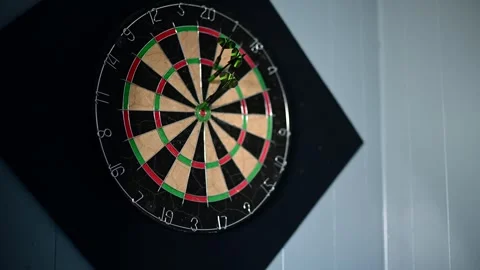 Throwing darts selective focus video, close up on the dart board Stock Footage 310043270